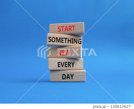 New symbol. Wooden blocks with words Start Something New Every Day. Beautiful blue background. Business and New concept. Copy space 138612627
