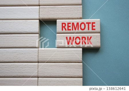 REMOTE WORK symbol. Concept word REMOTE WORK on wooden blocks. Beautiful grey green background. Business and REMOTE WORK concept. Copy space REMOTE WORK symbol. Concept word REMOTE WORK on wooden blocks. Beautiful grey green background. Business and REMOTE WORK concept. Copy space 138612641