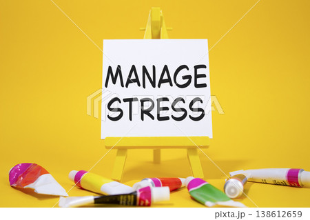 Manage stress symbol. Concept word Manage stress on wooden blocks. Beautiful yellow background with paints and easel. Business and Manage stress concept. Copy space Manage stress symbol. Concept word Manage stress on wooden blocks. Beautiful yellow background with paints and easel. Business and Manage stress concept. Copy space 138612659