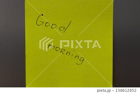 A bright yellow sticky note with a handwritten...の写真素材 [138612852] - PIXTA