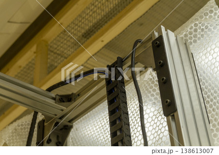 The device in the image is a vertical wall printer, a specialized inkjet printer designed to print directly onto vertical surfaces like walls The device in the image is a vertical wall printer, a specialized inkjet printer designed to print directly onto vertical surfaces like walls 138613007