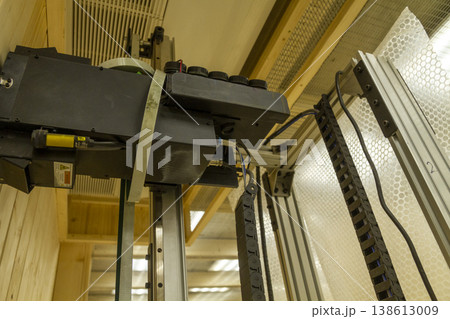 The device in the image is a vertical wall printer, a specialized inkjet printer designed to print directly onto vertical surfaces like walls 138613009
