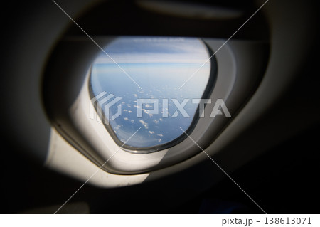 view of the sky through the airplane window view of the sky through the airplane window 138613071
