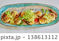 A multi-sensory gourmet appetizer featuring seared scallops with melted cheese 138613112