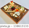 Cheese board featuring blue cheese, brie, and hard cheeses 138613133