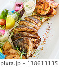 A multi-sensory seafood platter featuring grilled fish steaks and salmon 138613135