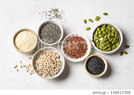 Assortment of seeds in bowls for healthy eating 138613308