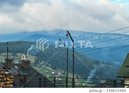 View of Bukovel Mountain Resort with Modern Lanterns and Misty Slopes 138613488