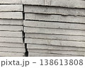 Stacked concrete slabs ready for construction in a busy urban area 138613808