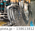 Shiny gardening tools hanging in a colorful display at the local store 138613812