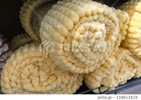 Cozy yellow blankets waiting to bring warmth and comfort to homes 138613819