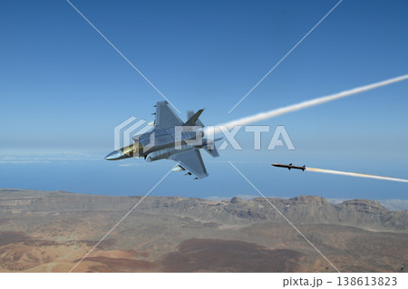 A missile attacks a modern fighter jet as it flies over the ground A missile attacks a modern fighter jet as it flies over the ground 138613823