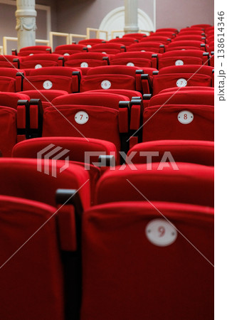 auditorium of cinema or theater. Empty rows of red velvet armchairs filling auditorium. auditorium of cinema or theater. Empty rows of red velvet armchairs filling auditorium. 138614346