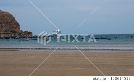 San Juan del Sur, Nicaragua - May 09, 2019: Sea travel and wanderlust. Wooden fishing boat in sea. Sea vacation. True wanderlust. Sea wave at the coast. Seascape with fishing boat and cruise ship San Juan del Sur, Nicaragua - May 09, 2019: Sea travel and wanderlust. Wooden fishing boat in sea. Sea vacation. True wanderlust. Sea wave at the coast. Seascape with fishing boat and cruise ship 138614515