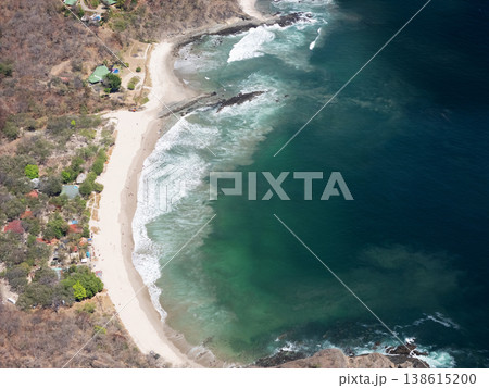 Coastline view with waves and beach in a tropical area 138615200