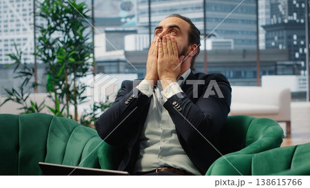 Overburdened director dealing with workload and financial instability, struggling to keep his business economy on the line. Unsuccessful anxious man feeling hopeless due to problems. Camera B. 138615766