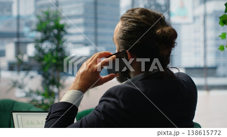 CEO engages in a phone call briefing with investor and sharing insight on sales analytics, discussing about a potential investment for growth. Partnership opportunities and ideas. Camera B. CEO engages in a phone call briefing with investor and sharing insight on sales analytics, discussing about a potential investment for growth. Partnership opportunities and ideas. Camera B. 138615772