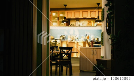 Contemporary home interior showing empty corridor in a modern apartment, warm interior light and wooden floor. Minimalist decoration creates a cozy fashionable domestic life atmosphere. 138615893