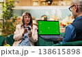 Isolated chroma key, aged woman, laptop in living room, retirement age, senior husband and wife enjoying quiet free time together. Old couple ensuring daily care with medicine for wellness. 138615898
