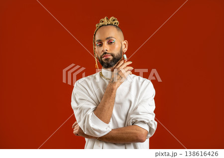 Make up artist Black latin gay man isolated on red 138616426