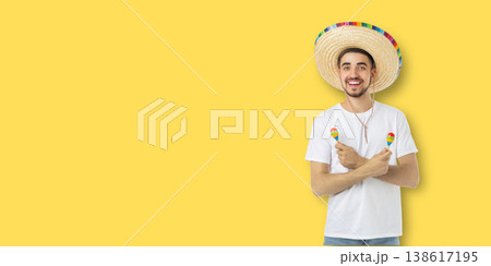 Man celebrates Cinco de Mayo with maracas and sombrero Man celebrates Cinco de Mayo with maracas and sombrero 138617195