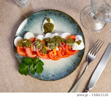 Caprese salad with pesto sauce and cilantro Caprese salad with pesto sauce and cilantro 138621120