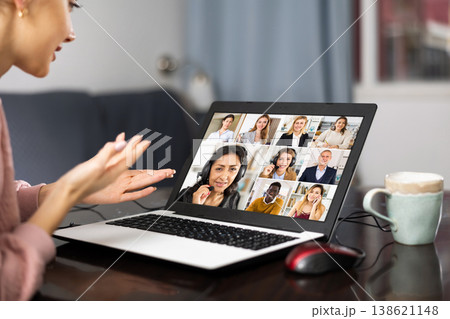 Woman having video conference with colleagues Woman having video conference with colleagues 138621148