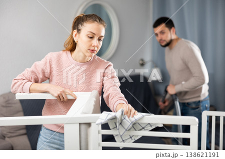 Wife and husband cleaning up in apartment Wife and husband cleaning up in apartment 138621191
