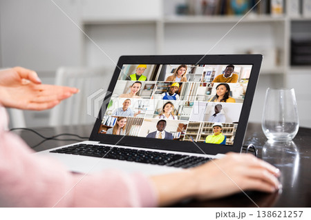 Young woman is holding a video conference on a laptop Young woman is holding a video conference on a laptop 138621257