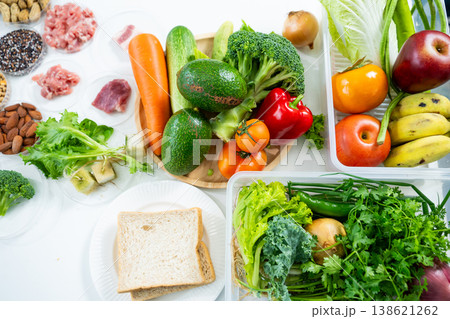 Top view of raw meat, fresh vegetables, grains, nuts, and legumes for health, nutrition, and diet planning. Perfect for food science and wellness lifestyle concepts. Top view of raw meat, fresh vegetables, grains, nuts, and legumes for health, nutrition, and diet planning. Perfect for food science and wellness lifestyle concepts. 138621262