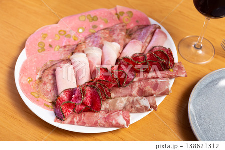 Sausage mix, slicing of various types of sausages served with aperitif. Sausage mix, slicing of various types of sausages served with aperitif. 138621312