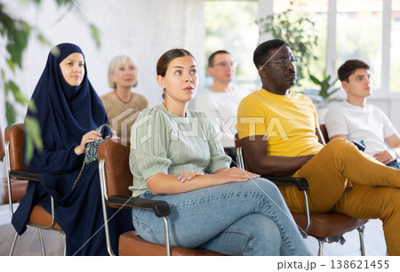 Young girl sitting at lecture with group of women and men Young girl sitting at lecture with group of women and men 138621455