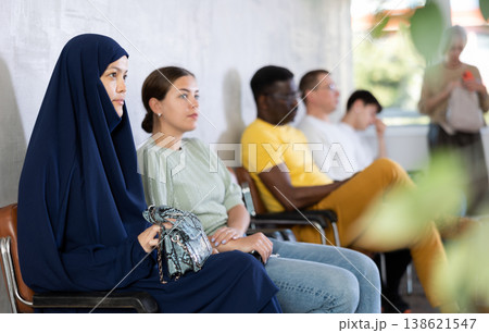 Young arab woman waiting in line at reception Young arab woman waiting in line at reception 138621547