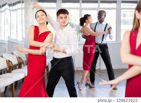 Young guy and young woman dance tango 138621622
