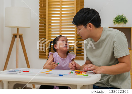 father comforting crying preschool child girl while drawing and painting with oil pastels at father comforting crying preschool child girl while drawing and painting with oil pastels at 138622362