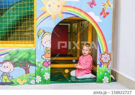 The child plays in a special playroom with different toys 138622727