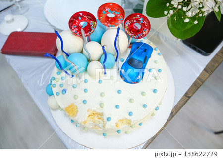 Cake for a boy with cars and sweets 138622729