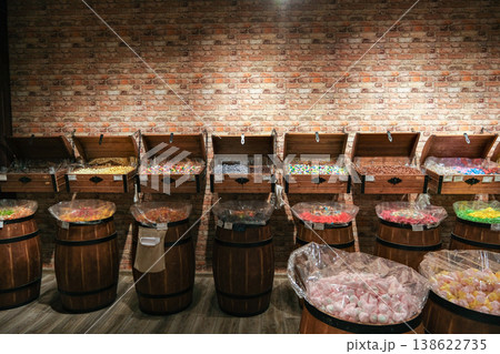 A row of wooden barrels filled with candy 138622735