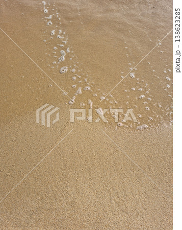 It is a sandy beach with waves rolling in. It is a sandy beach with waves rolling in. 138623285