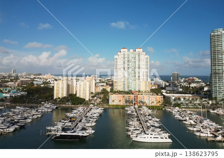 Docked yacht in port of Miami. Marina luxury cityscape. Port with yacht. Yachting marina. Luxury yacht charter. Miami port marina. Luxury yachting in summer. Charming marina Docked yacht in port of Miami. Marina luxury cityscape. Port with yacht. Yachting marina. Luxury yacht charter. Miami port marina. Luxury yachting in summer. Charming marina 138623795