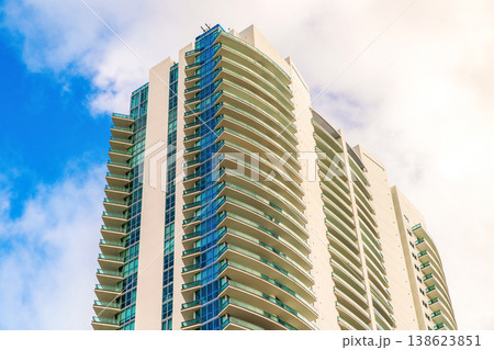 Low angle view of building. Residential building architecture. Architectural exterior detail. Residential house modern exterior. Modern apartment building. Apartment hotel building. Condominium Low angle view of building. Residential building architecture. Architectural exterior detail. Residential house modern exterior. Modern apartment building. Apartment hotel building. Condominium 138623851