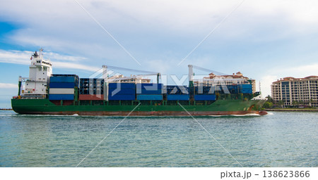 Cargo ship with container. Freight container loaded on cargo vessel. View of cargo ship navigating the sea leaving or entering harbor. Cargo business concept. Container ship Cargo ship with container. Freight container loaded on cargo vessel. View of cargo ship navigating the sea leaving or entering harbor. Cargo business concept. Container ship 138623866