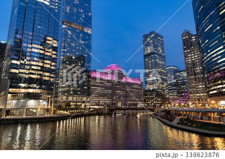 Night cityscape of Chicago skyscraper building. Chicago architecture of skyscraper. City night illuminated building. Skyscraper cityscape. Night city of Chicago. Business city Night cityscape of Chicago skyscraper building. Chicago architecture of skyscraper. City night illuminated building. Skyscraper cityscape. Night city of Chicago. Business city 138623876