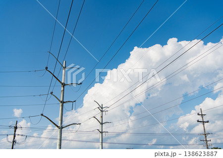 Electric voltage station. High voltage. Electricity power pylon. Electricity tower. Electrical energy. Power transmission tower. Electricity power lines and sky. Green energy. High tension Electric voltage station. High voltage. Electricity power pylon. Electricity tower. Electrical energy. Power transmission tower. Electricity power lines and sky. Green energy. High tension 138623887