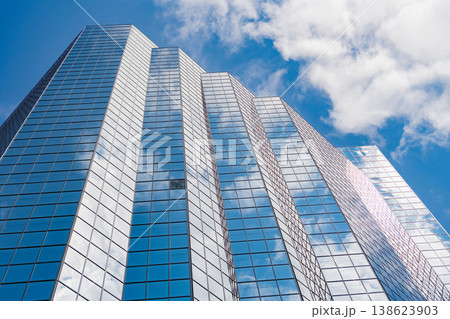 Commercial architecture. Business skyscraper building. Architectural building business area. Glass skyscraper. City architecture. Architecture of office building. Shimmering glass tower Commercial architecture. Business skyscraper building. Architectural building business area. Glass skyscraper. City architecture. Architecture of office building. Shimmering glass tower 138623903