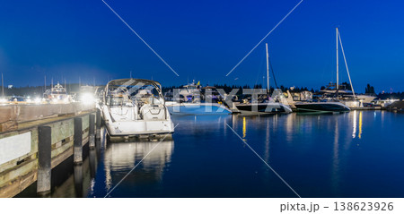Luxury marina with private yacht boat. Docked yacht boat in harbor. Marina night. Luxury summer vacation in Miami. Private boat at night. Marina with luxury sea boat. Yacht club and marina in Miami 138623926