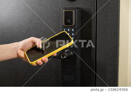 Modern smart door lock with digital keypad and keyless entry via smartphone. Modern smart door lock with digital keypad and keyless entry via smartphone. 138624568