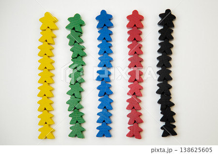 On a white background, men of different colors lie in a line, with a large man at the base, divided into teams. The concept of team competitions, community groups, people. High quality photo On a white background, men of different colors lie in a line, with a large man at the base, divided into teams. The concept of team competitions, community groups, people. High quality photo 138625605