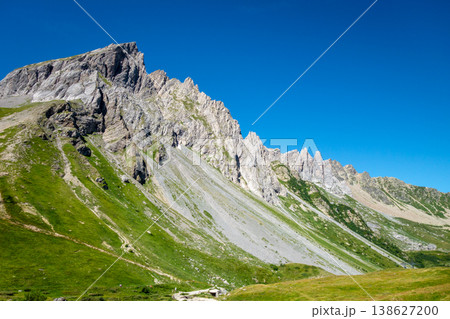 Aiguilles de la Pennaz Limestone cliffs and grassland near Les Contamines Montjoie France 138627200