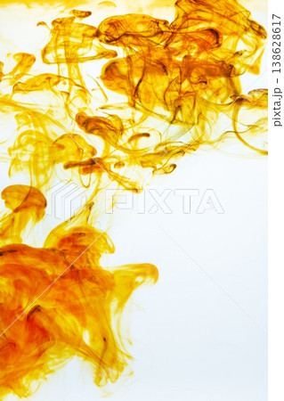 Iodine antiseptic drop dispersing in water, creating abstract patterns. Healthcare, disinfection, and medical treatment concept. 138628617